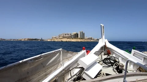 Sailing yacht off shore with beautiful sight of mighty Maltese forts Stock Footage 123732405