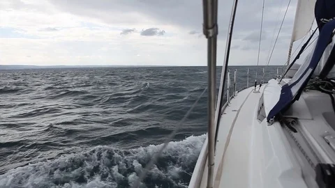 Sailing yacht in the wind on the waves Stock Footage 76279213
