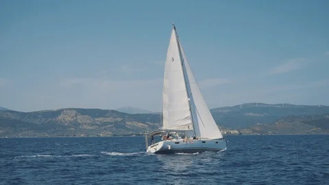 Sailing yachts against the backdrop of mountains. View from the yacht. Stock Footage 114963532