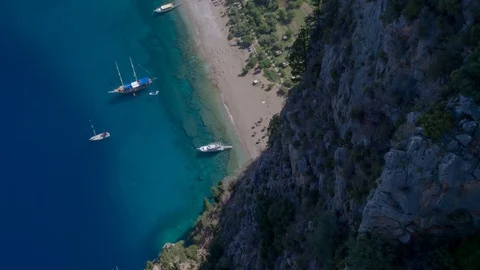 Sailing yachts sailing in the background. Mountains in the background. Stock Footage 105701234