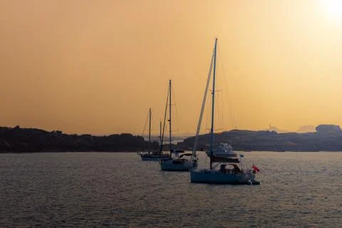 Sailing yachts at sunset Stock Photos