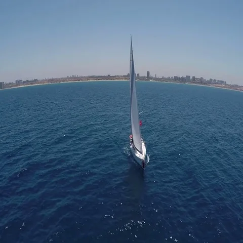 Sailing yachts with white sails in the open Sea. Drone view - birds eye angle. Stock Footage 69406826