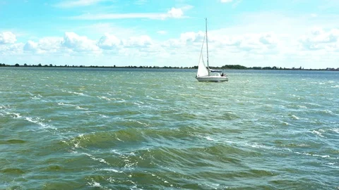 Sailing yachts with white sails in the open sea Stock Footage 104460828