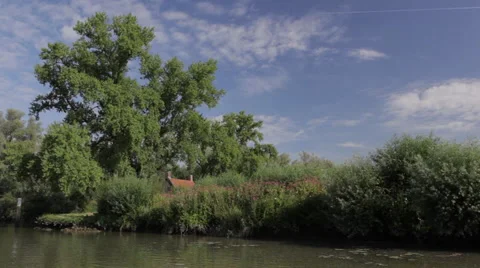 Sailing_past_riverbank Stock Footage 49164658