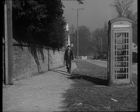 Sailor calls headquarters for help with broken engine of his boat, UK 1950 Stock Footage 132330159