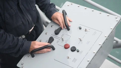 Sailor controlling mine neutralization vehicle from console Stock Footage 86894023