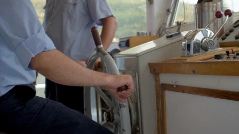 A sailor at the helm of a tour boat heading to Dubrovnik, Croatia Stock Footage 241700364