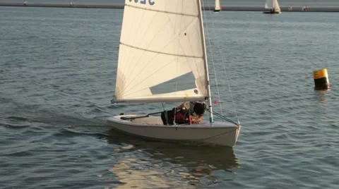 Sailor in laser dinghy tacking Stock Footage