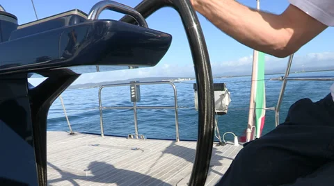 Sailor manoeuvring  steering wheel Stock Footage 37090620