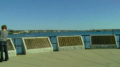 Sailor Memorial in Front of Ocean Stock Footage 10852101