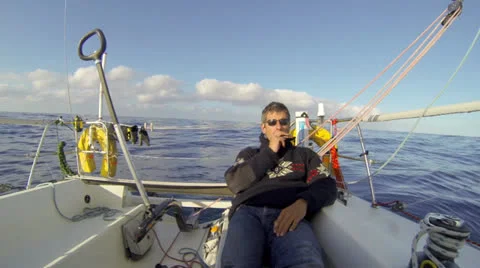 Sailor playing the harmonica with a gloomy tune. Stock Footage 25408194