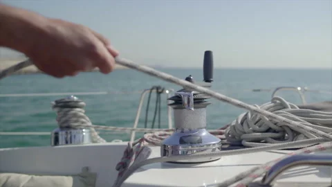 A sailor pulls a rope for some reason in the Mediterranean Sea. Sunny Day, HD 스톡 동영상 130901560