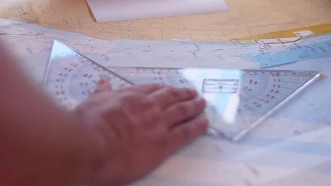 sailor reading nautical chart map - Sailor Reading Nautical Chart Map Footage 083260038 Iconl 