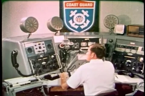 Sailor reports a problem to coast guard and then it's relayed to Navy - 1970 Video stock 94255413