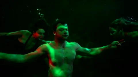 Sailor is sinking in dark depth of ocean, diving on bottom to mermaid, fairytale 動画素材 169857288