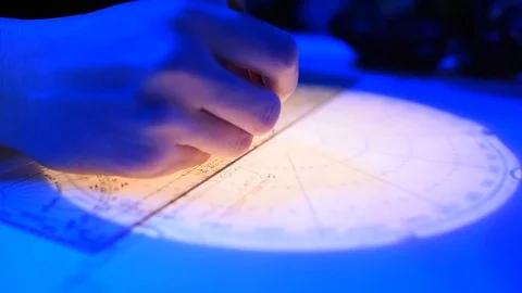 Sailor working on navigation chart in control room aboard USS Mount Whitney 動画素材 110843505
