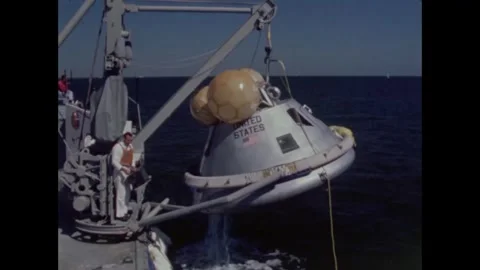 Sailors hoist Apollo 8 command module onto motor vessel Video stock 271519158