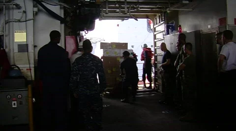 Sailors loading pallets on ship (HD) c Stock Footage 691580