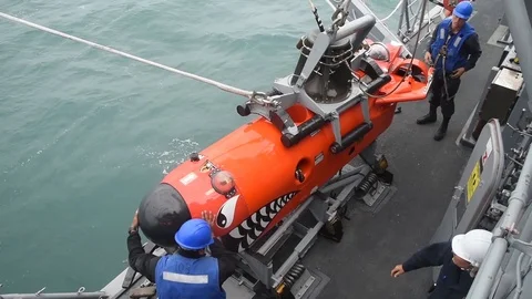 Sailors preparing to launch Mine Neutralization Vehicle from USS Chief Stock Footage 86893911