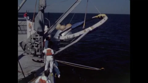 Sailors pull Apollo 8 command module towards motor vessel Stockbeeldmateriaal 271517315