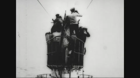 Sailors standing on conning tower of submarine Stock Footage