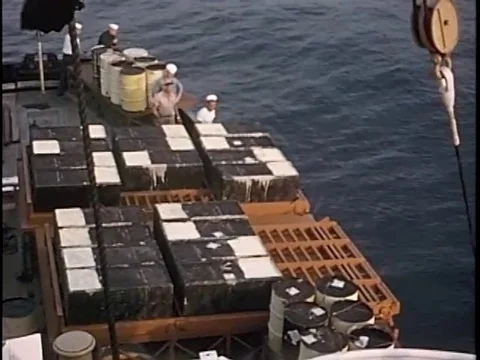 Sailors throw the concrete burial vaults in the deep sea - 1959 Stock Footage 93692053