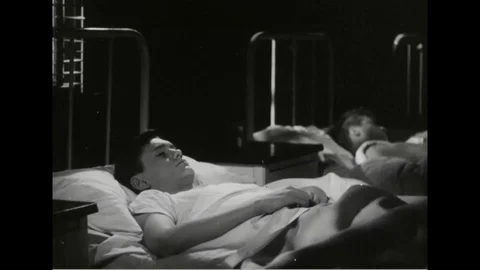 Sailors trying to sleep on bed - 1945 Stock Footage 101407487