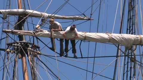 Sailors tying up sails Stock Footage 11140424