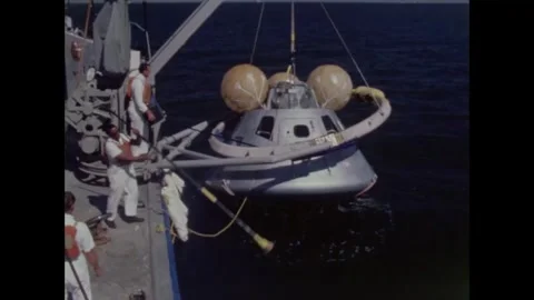 Sailors winch Apollo 8 command module onto motor vessel Stockbeeldmateriaal 271517440