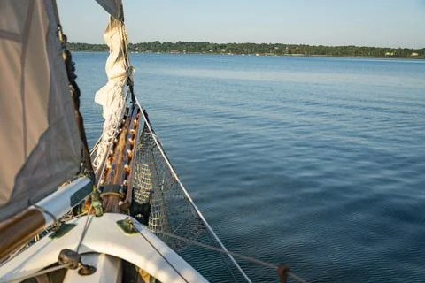 Sails folded and lashed to the bow on the Atalntic Ocean in Maine Foto stock