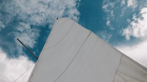 The sails of the yacht flutter in the wind Stock Footage 305694274