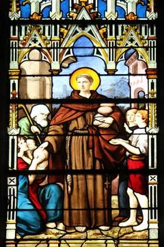 Saint Anthony distributes bread, stained glass, Saint Severin church, Pari... Stock Photos