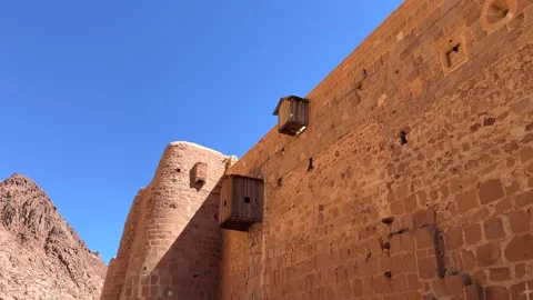 Saint Catherine Monastery defensive wall in rocky mountain landscape Stock Footage 341452264