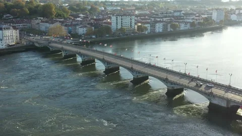 Saint-Esprit bridge crossing Adour River, Bayonne in France. Aerial drone Stock Footage 235350931