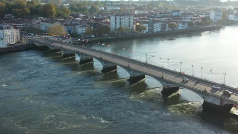 Saint-Esprit bridge crossing Adour River, Bayonne in France. Aerial drone Stock Footage 297775498