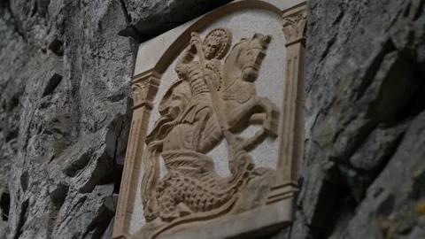 Saint George stone icon displayed on a natural rock wall Stock-Footage 301920549