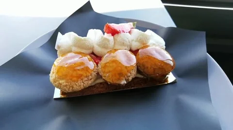 Saint-honoré : Glazed puffs stuffed with vanilla "Bourbon" pastry cream Stock Footage