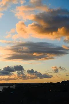 Saint Ives Sunset Clouds Above Coastal Rooftops, Cornwall, England Stock Photos