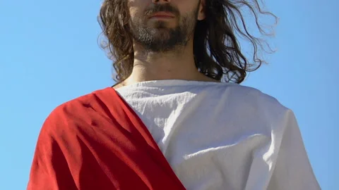 Saint Jesus stretching saving hand, helping sinners to find heaven, Christianity Stock-Footage 113934462