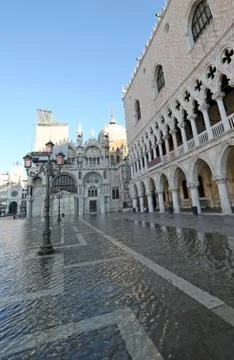 Saint Mark square and Doges Palace with high tide in winter in Venice Italy Фото