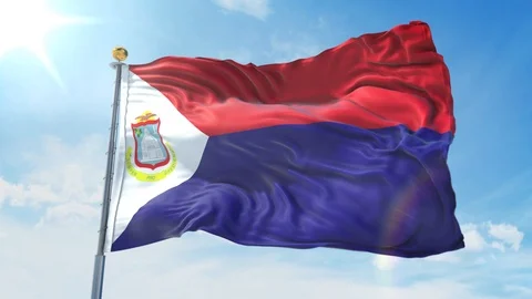 Saint Martin flag waving in the wind against deep blue sky. National theme. 库存影片 123985639
