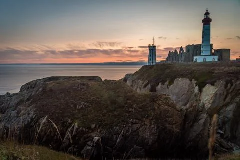 Saint Mathieu lighthouse in Brittany at sunset in France Foto stock