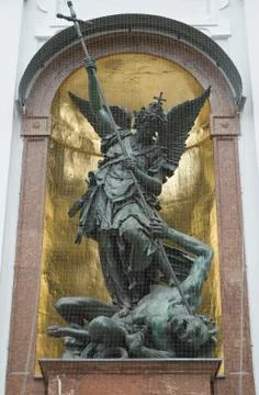 Saint michael defeats satan Stock Photos