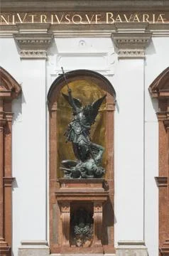 Saint michael defeats satan Stock Photos