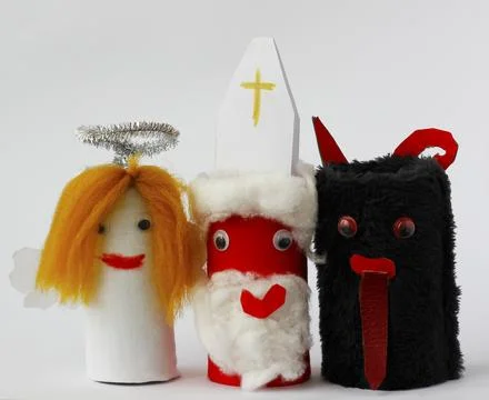 Saint Nicholas, Angel and Devil made by a child from toilet paper roll tubes Stock Photos
