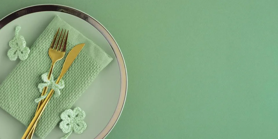 Saint Patrick Day Table Setting with Clover Decor. Festive Green Arrangement Stock Photos