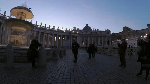 Saint Peter square with a fountain in foreground  at dusk Stock Footage 99337403