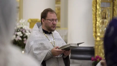 SAINT-PETERSBURG, RUSSIA - JULY 29, 2017: Priest in church Stock Footage