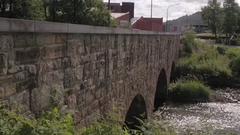 Saint Vith - Belgium Circa 2018 - Creek Flowing Under Stone Arch Bridge Stock Footage 325578534