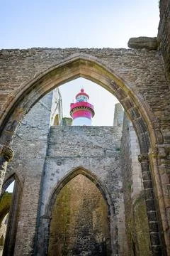 Saint?Mathieu Lighthouse Framed by Gothic Arches of Abbey Ruins, Plougonvel.. Photos